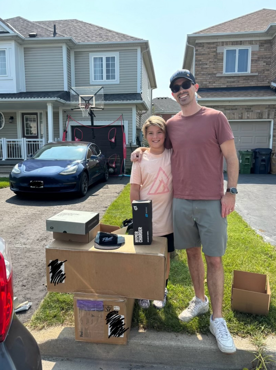 Man and son standing in front of Onewheels